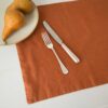 Swans Island Company's linen plaemats by Linen Tales, made with 100% European Linen Oeko-Tex® and EUROPEN FLAX® certified. Made with stonewashed soft linen with mitered corners for a crisp edge. Shown here in Baked Clay color.