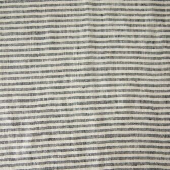 Swans Island Company's linen placemats by Linen Tales, made with 100% European Linen Oeko-Tex® and EUROPEN FLAX® certified. Made with stonewashed soft linen with mitered corners for a crisp edge. Shown here in Thin Black Stripe swatch.