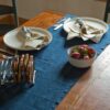 Swans Island Company's linen table runner by Linen Tales, made with 100% European Linen Oeko-Tex® and EUROPEN FLAX® certified. Made with stonewashed soft linen with mitered corners for a crisp edge. Shown here in Navy Blue color.