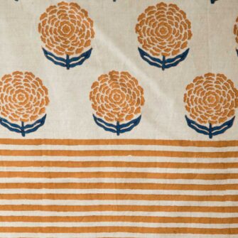 Swans Island Alisha Table Runner by Soil to Studio. Block printed by hand in India with bright playful patterns. Shown here in Natural with Yam. Swatch