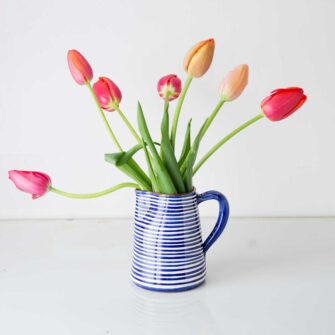 Swans Island Company's Striped Terracotta Pitcher - Handmade in Portugal. Shown here in Blue and white.