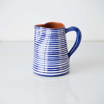 Swans Island Company's Striped Terracotta Pitcher - Handmade in Portugal. Shown here in Blue and white.