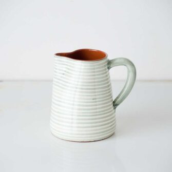 Swans Island Company's Striped Terracotta Pitcher - Handmade in Portugal. Shown here in Sage and White.