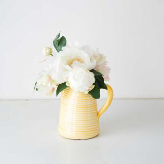 Swans Island Company's Striped Terracotta Pitcher - Handmade in Portugal. Shown here in Tangerine Yellow and White.