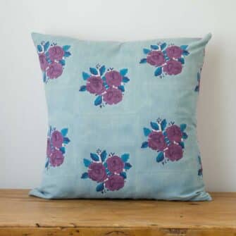 Swans Island Company's Sara Pillow Cover by Soil to Studio. Block printed by hand in India on a linen fabric with a vintage floral rose pattern. Shown here in Denim with roses.