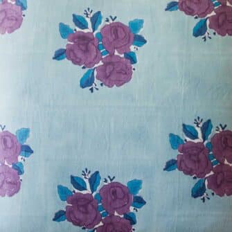 Swans Island Company's Sara Pillow Cover by Soil to Studio. Block printed by hand in India on a linen fabric with a vintage floral rose pattern. Shown here in Denim with roses. swatch