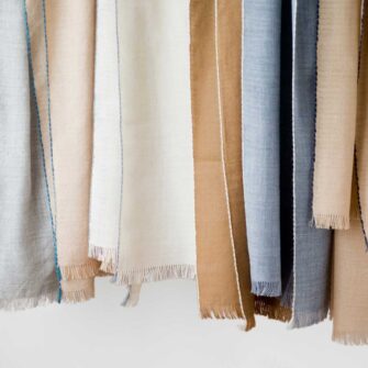 Swans Island Company's Royal Alpaca Whisper Shawl - Woven with the softest luxurious Royal alpaca. Made in Peru. Shown here in various colorways.