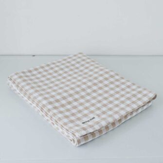 Swans Island Company's Gingham Check tablecloth. Woven in Maine. Shown here in Beige & White.