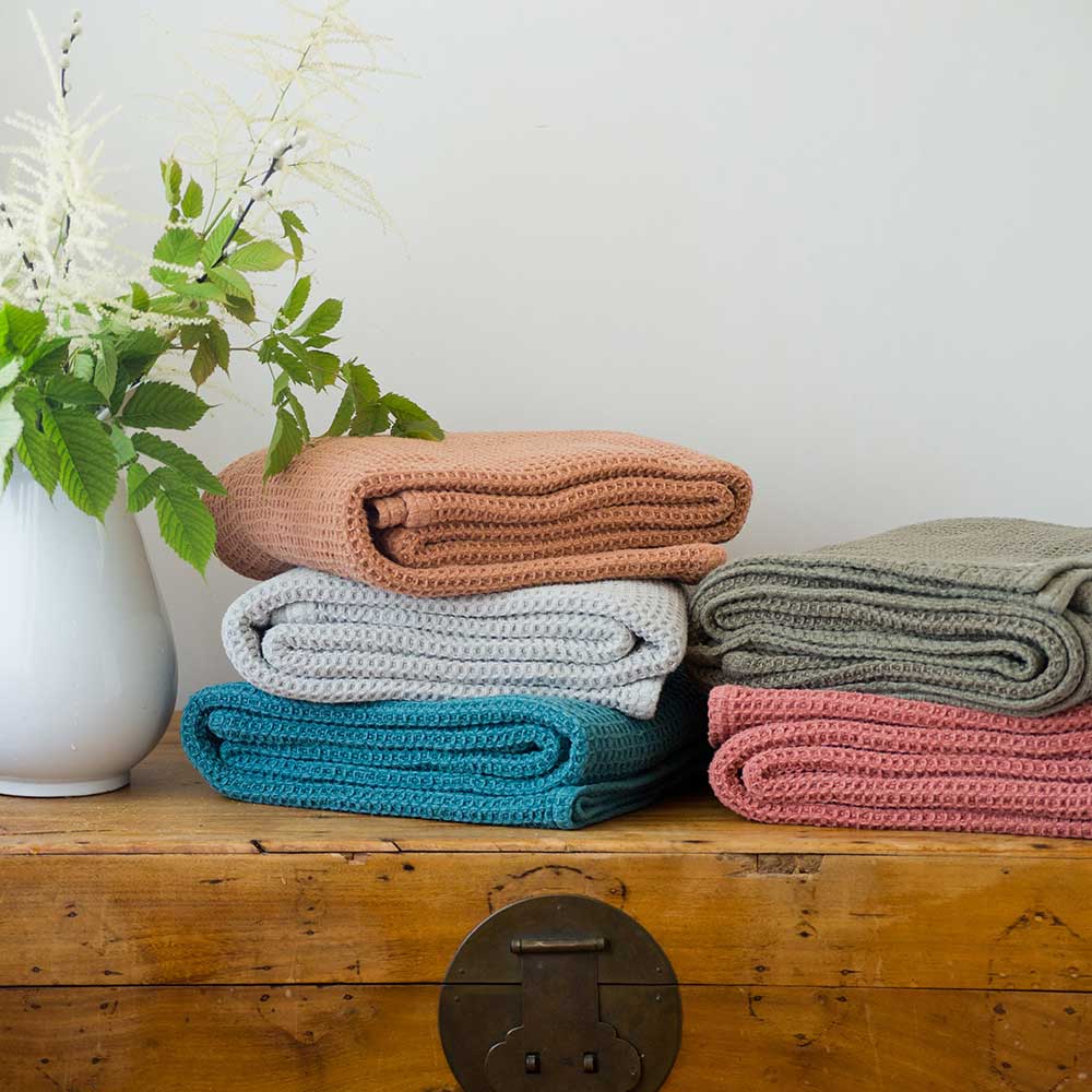 Swans Island Company's Cotton Waffle Throw Blanket is squishy and soft - perfect for tender babes. Made in Maine with 100% American cotton. Shown here in a range of autumn hues.