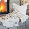 Casa Branca x Swans Island - Branca Ticking Stripe Throw . 100% soft merino wool with hand-dyed stripes and ivory silk binding. Handwoven in Maine. Shown here in Biscotti.
